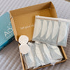 Box of skincare products with AO2 packaging on a textured surface