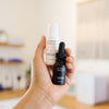 Hand holding a Vivant skincare mini duo products in an estheticians office