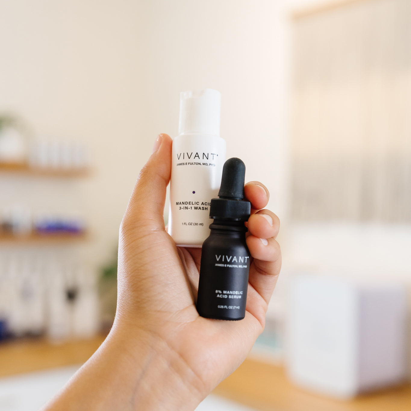 Hand holding a Vivant skincare mini duo products in an estheticians office