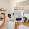 Person holding Vivant Dark Spots Duo kit in an estheticians office