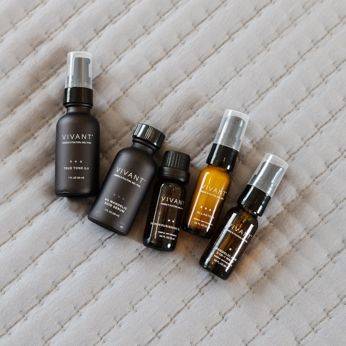 Collection of Vivant dark spots duo products on a textured surface