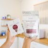 Person holding Vivant Redness & Texture Duo kit in an estheticians office