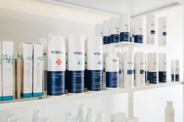Shelves with various 'Wish' skincare products in a store setting