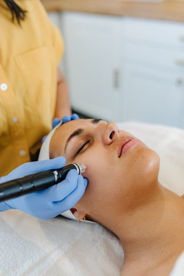 Women receiving hydrafacial treatment on her face
